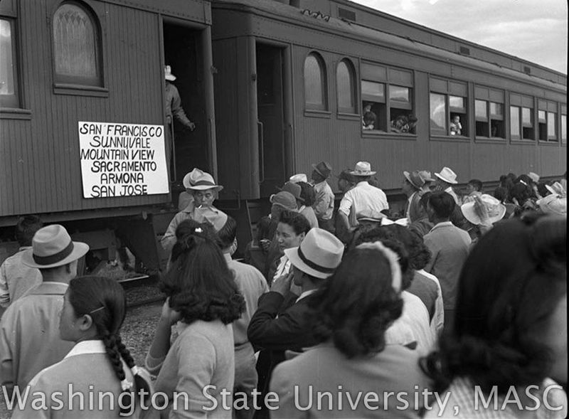 Crowd gathered at a train departing for California