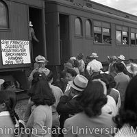 Crowd gathered at a train departing for California