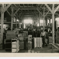 Crates and luggage stored in a warehouse. 