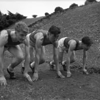 Three members of the Washington State College track team, including Tom Hide (center)